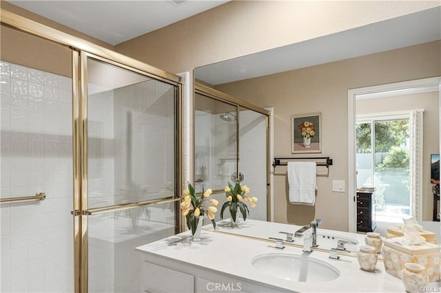 bathroom with a stall shower and vanity