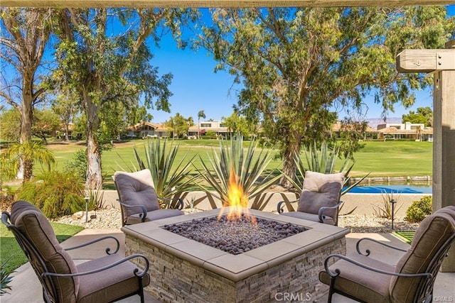 view of patio featuring an outdoor fire pit