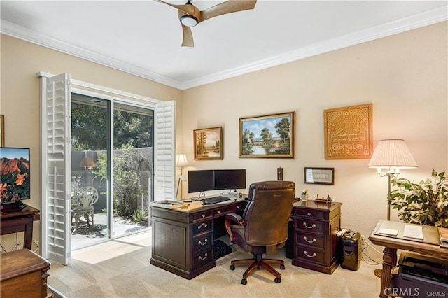 office area with a ceiling fan, light colored carpet, and crown molding