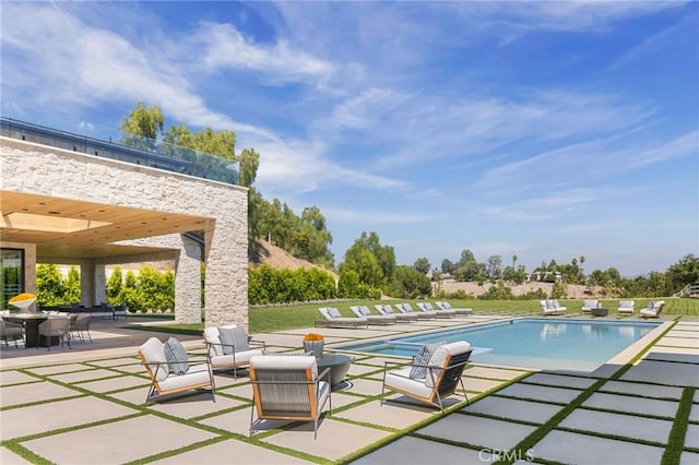 view of pool with a patio