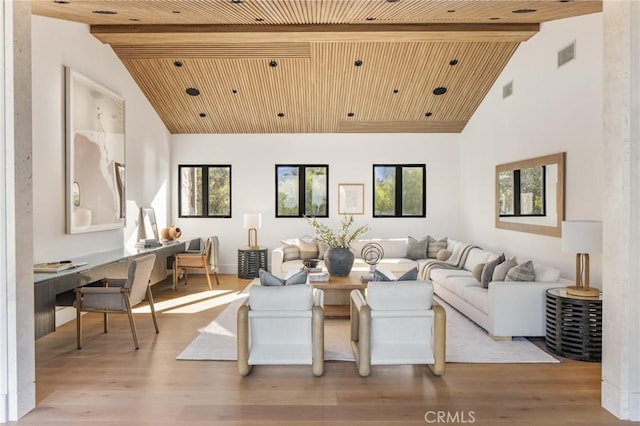 living room featuring light hardwood / wood-style floors, wood ceiling, beam ceiling, and high vaulted ceiling