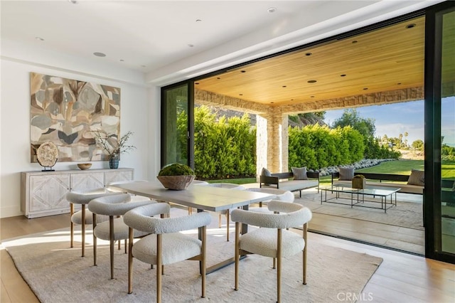 dining space featuring light hardwood / wood-style floors