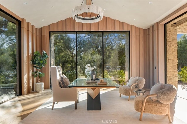 sunroom featuring vaulted ceiling