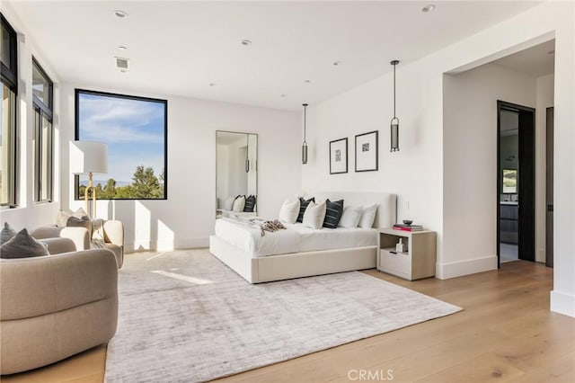 bedroom with hardwood / wood-style flooring