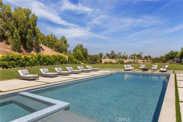 view of pool featuring a yard, an in ground hot tub, and a patio