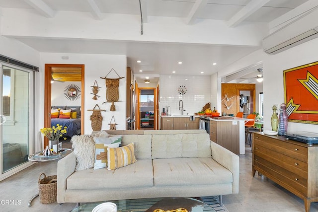 living room with sink, a wall mounted air conditioner, and beam ceiling