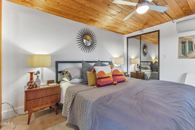 bedroom featuring ceiling fan, a wall mounted air conditioner, wooden ceiling, light colored carpet, and a closet