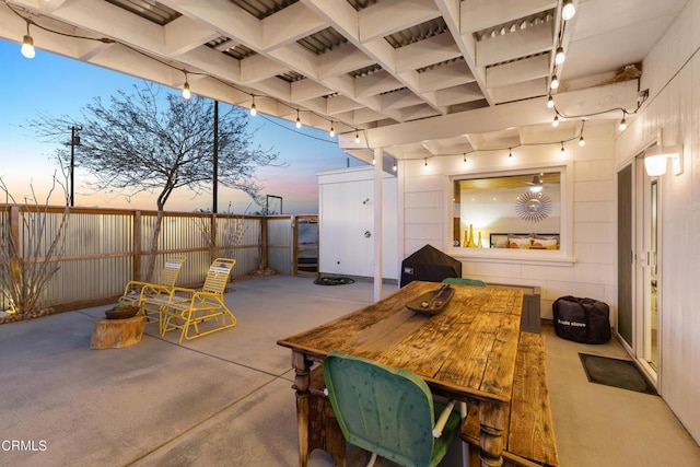 view of patio terrace at dusk