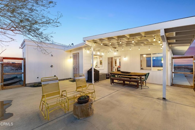 view of patio terrace at dusk