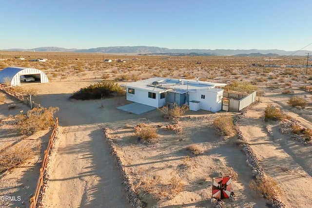 drone / aerial view featuring a mountain view