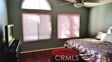 bedroom with wood-type flooring and ceiling fan