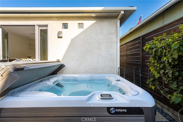 view of patio with a covered hot tub