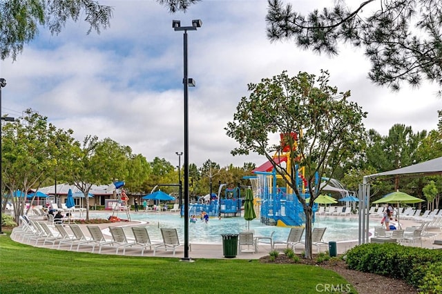 view of community with a lawn and a playground