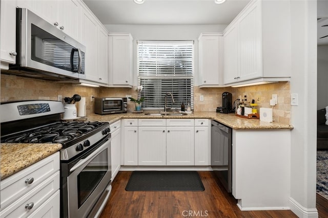 kitchen featuring white cabinetry, sink, and stainless steel appliances