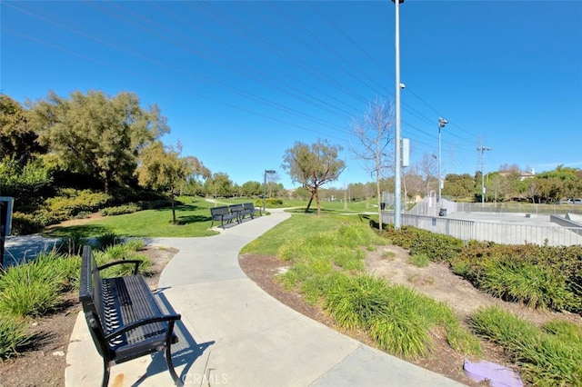 view of property's community with a yard