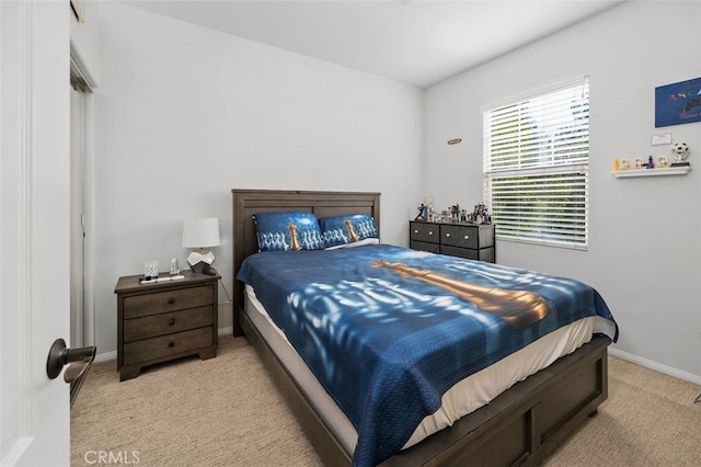 bedroom featuring light colored carpet