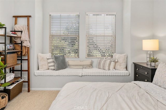 bedroom featuring light carpet