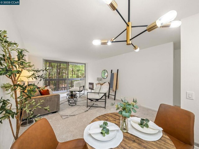 carpeted living room with a chandelier