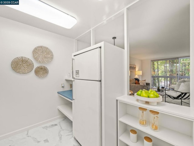 kitchen featuring white fridge