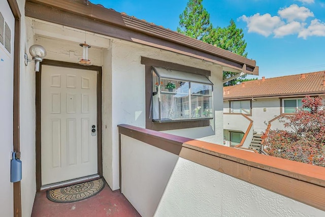 doorway to property featuring a balcony