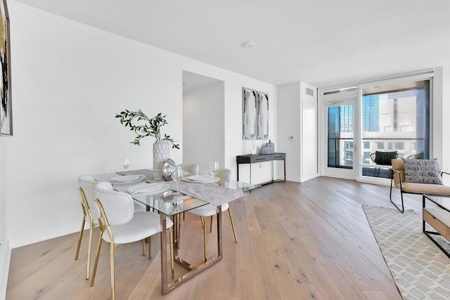 dining area with light hardwood / wood-style flooring