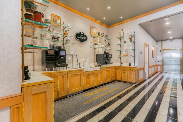 bar with tile countertops, sink, dark tile patterned flooring, and ornamental molding