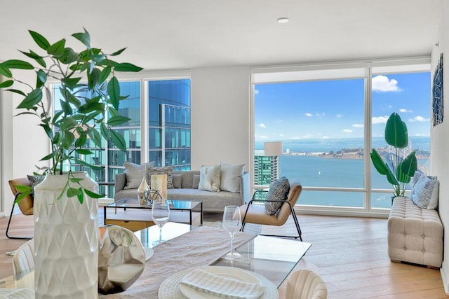 sunroom / solarium featuring a water view