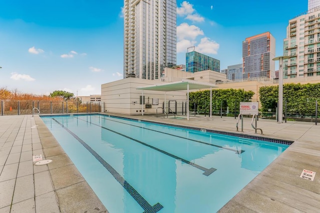 view of pool featuring a patio