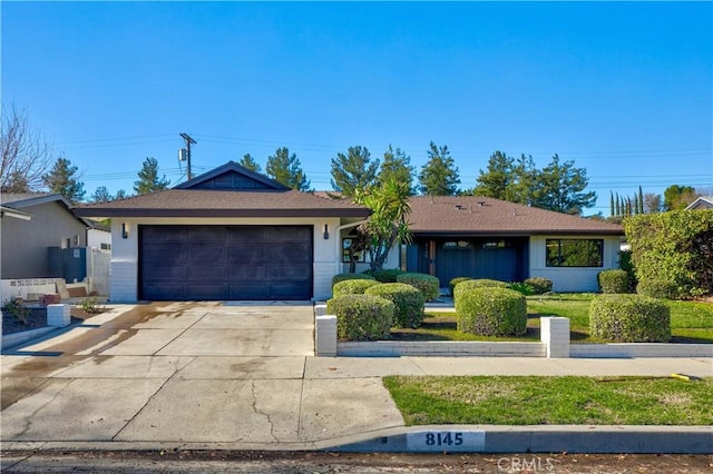 ranch-style house featuring a garage