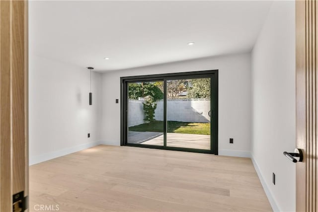 empty room featuring light hardwood / wood-style floors