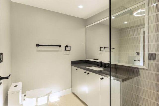 bathroom with vanity, tile patterned floors, a shower with door, and toilet