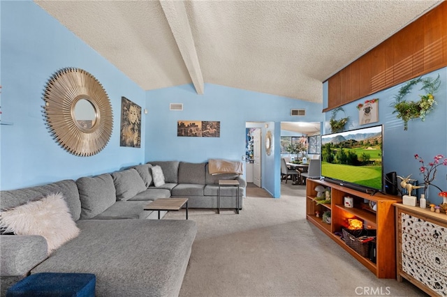 living room featuring a textured ceiling, lofted ceiling with beams, and light colored carpet