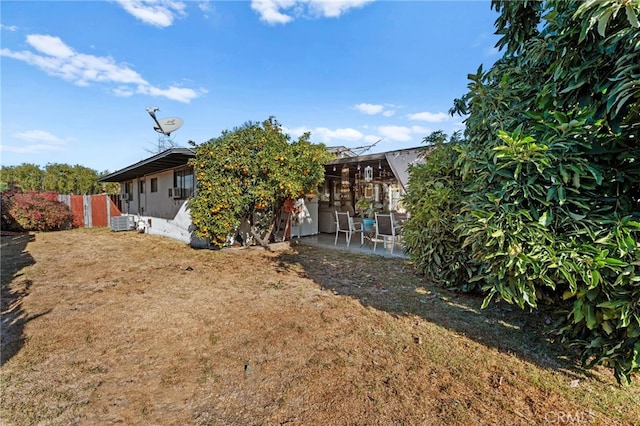 view of yard featuring cooling unit and a patio area