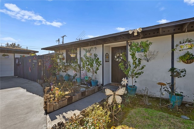 view of exterior entry featuring a patio area