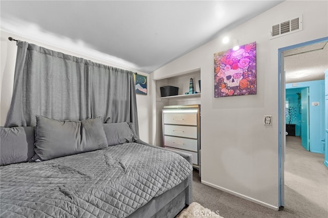 bedroom featuring carpet flooring and lofted ceiling