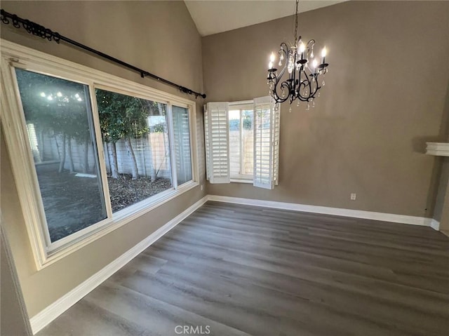 unfurnished dining area featuring dark hardwood / wood-style floors and a notable chandelier