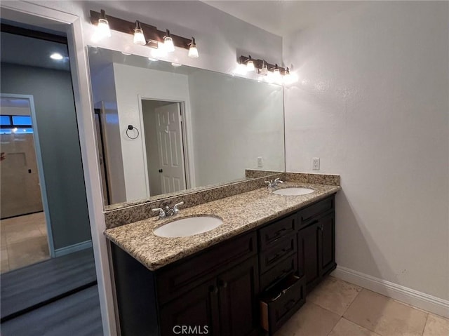 bathroom featuring tile patterned floors and vanity