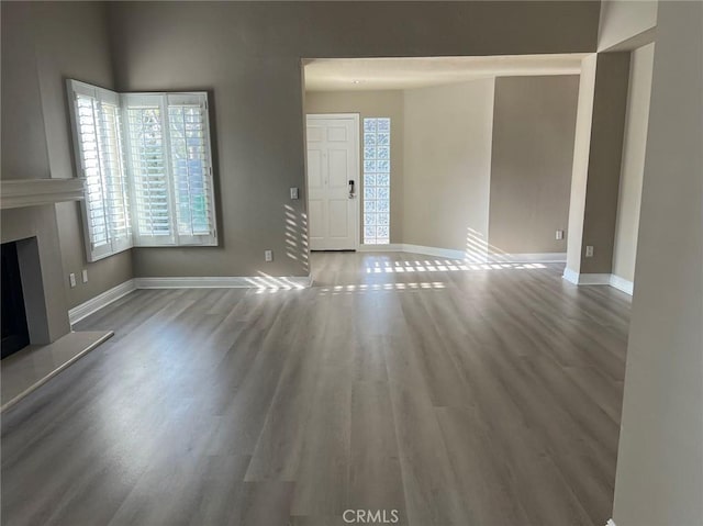 unfurnished living room featuring hardwood / wood-style floors