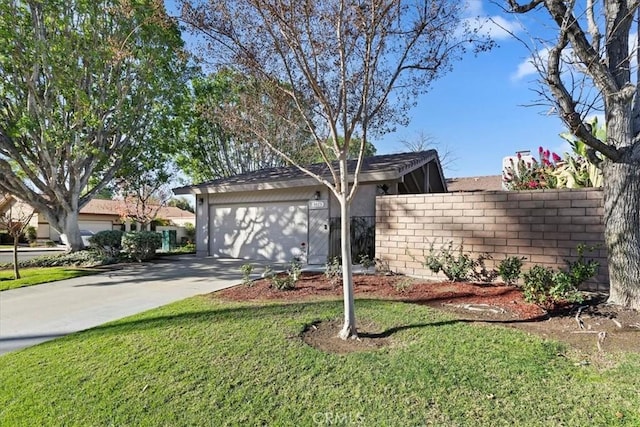 view of front of property with a front yard and a garage