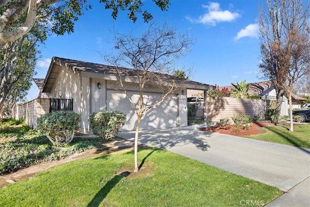 ranch-style house featuring a garage and a front yard