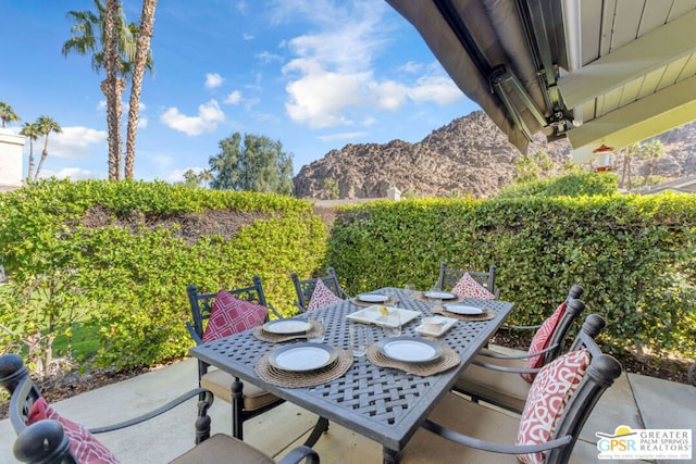 view of patio / terrace featuring a mountain view