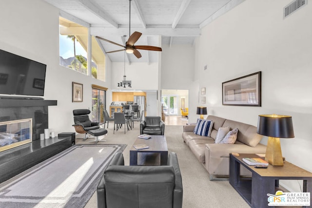 living room featuring ceiling fan, wooden ceiling, beamed ceiling, high vaulted ceiling, and light carpet