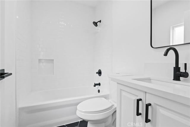 full bathroom with tile patterned floors, vanity,  shower combination, and toilet