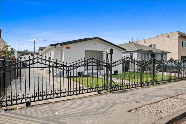 view of gate with a yard