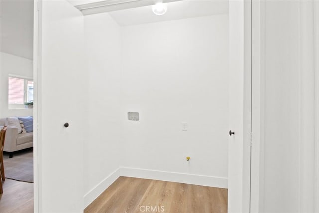 laundry room with light hardwood / wood-style flooring