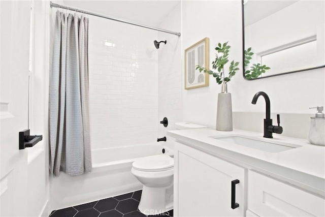 full bathroom with shower / tub combo, vanity, and toilet