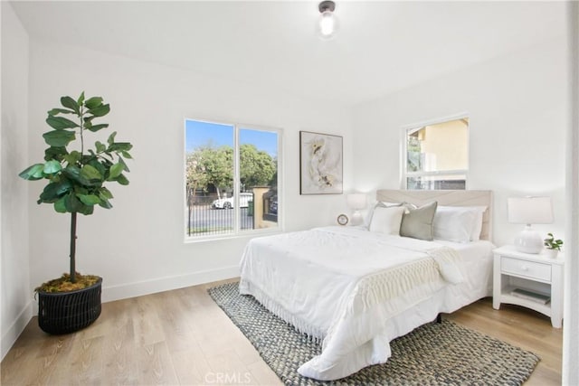 bedroom with light hardwood / wood-style floors