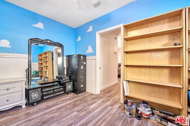 office space with hardwood / wood-style floors and a textured ceiling