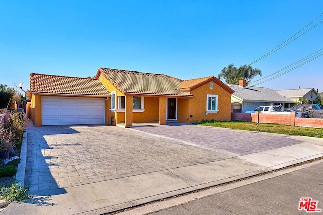 single story home featuring a garage