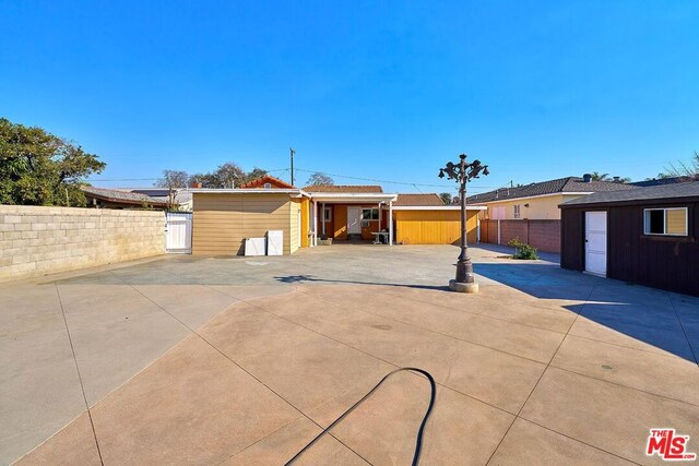 ranch-style house with a patio